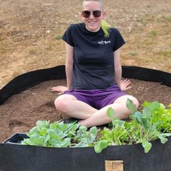 Taproot Hydroponics - 300 gallon Fabric Raised Bed filled with soil, person for scale