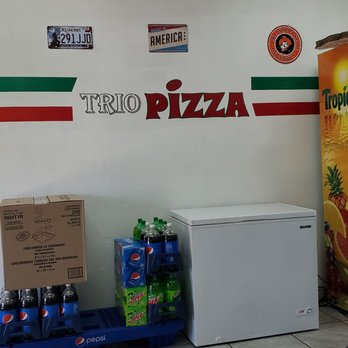 Trio pizza - a man standing in front of a refrigerator - Pizza Near Me - Midwest City, Oklahoma Trio pizza - a man standing in front of a refrigerator - Pizza Near Me - Midwest City, Oklahoma