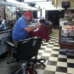Mike's Barber Shop - Very low key, little buddy hanging in there for his lollipop.