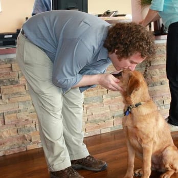 Holistic Veterinary Care - Dr. Richter greeting a young guy. - Veterinarians Near Me - Oakland, California