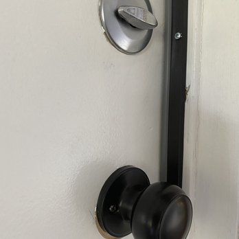 Remmi Construction - Hardware does not match, they replaced the locking garage door with a blank pull. - General Contractors Near Me