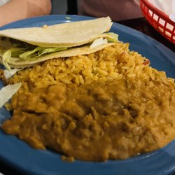 Cactus Cantina Mexican Grill - This is the Kid's Soft Taco with ground beef, lettuce, and no cheese. It comes with rice and beans. It has a corn tortilla.