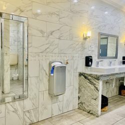 Maddie's - "Potty like a rockstar" Lovely sparkling white marble ladies room OuiOui.