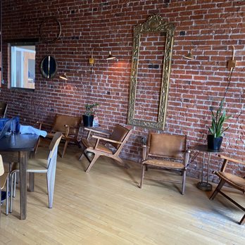 Ivywild Kitchen - a dining room with a brick wall - American Near Me - Colorado Springs, Colorado
