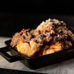 Bake’n Bacon - Brisket Mac  Mac topped with shaved brisket & parmesan cheese.