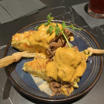 The Rustic - Texas tamales.. smoked brisket with chipotle garlic queso..$16 - Breakfast & Brunch Near Me - Houston, Texas