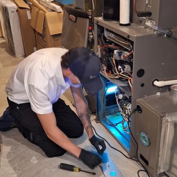 The Comfort Group - Technician servicing a furnace - Heating & Air Conditioning/HVAC Near Me - Duncan, British Columbia The Comfort Group - Technician servicing a furnace - Heating & Air Conditioning/HVAC Near Me - Duncan, British Columbia