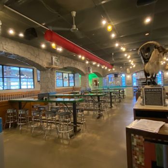 Rodeo Goat - Inside, the Goat greets you.   Long tables are shared.  There are 5 only private  booths seats 4 - Burgers Near Me - Frisco, Texas
