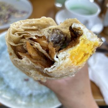 Toast Kitchen & Bakery - Sisig burrito - initial bites - Breakfast & Brunch Near Me - Tustin, California Toast Kitchen & Bakery - Sisig burrito - initial bites - Breakfast & Brunch Near Me - Tustin, California