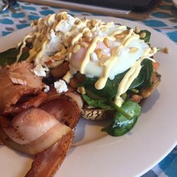 The Flour Pot Cafe - Harvest Stacker: sourdough with a light spread of hommus, topped with seasonal veggies, spinach, poached eggs and pine nuts