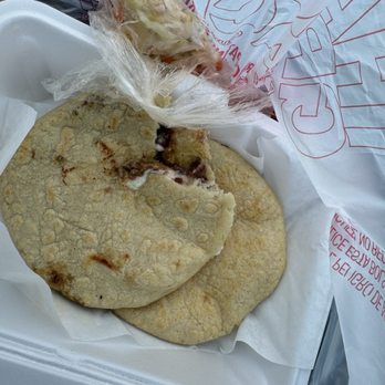Pupusería La Sierra - Took a bite of my revuelta lol before my pic - Salvadoran Near Me - Moreno Valley, California