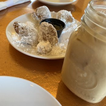 Another Broken Egg Cafe - Beignets with honey marmalade and French roast cold brew made with milk and French vanilla cream - Breakfast & Brunch Near Me - Pensacola, Florida Another Broken Egg Cafe - Beignets with honey marmalade and French roast cold brew made with milk and French vanilla cream - Breakfast & Brunch Near Me - Pensacola, Florida