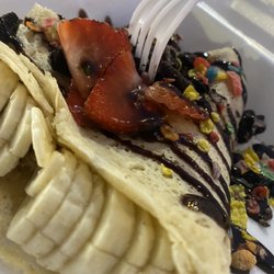 Crepes Hollywood - Banana/ Strawberry Nutella Crepe + Oreo Cookies + Fruit Pebbles + Chocolate Syrup