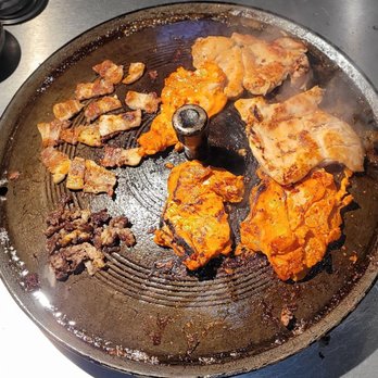 O2 BBQ - Marinated Chicken, Pork Belly, & Steak being cooked - Korean Near Me - Guttenberg, New Jersey O2 BBQ - Marinated Chicken, Pork Belly, & Steak being cooked - Korean Near Me - Guttenberg, New Jersey
