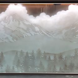 Art Glass and Metal - Etched Glass backsplash in Brasada Ranch. Scene depicts the "Three Sister" peaks in central Oregon. Panel is 7 feet long