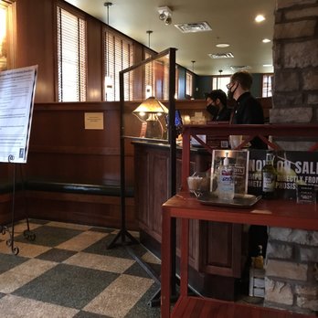 Carlyle Grill - a woman standing at the counter - American Near Me - Ann Arbor, Michigan