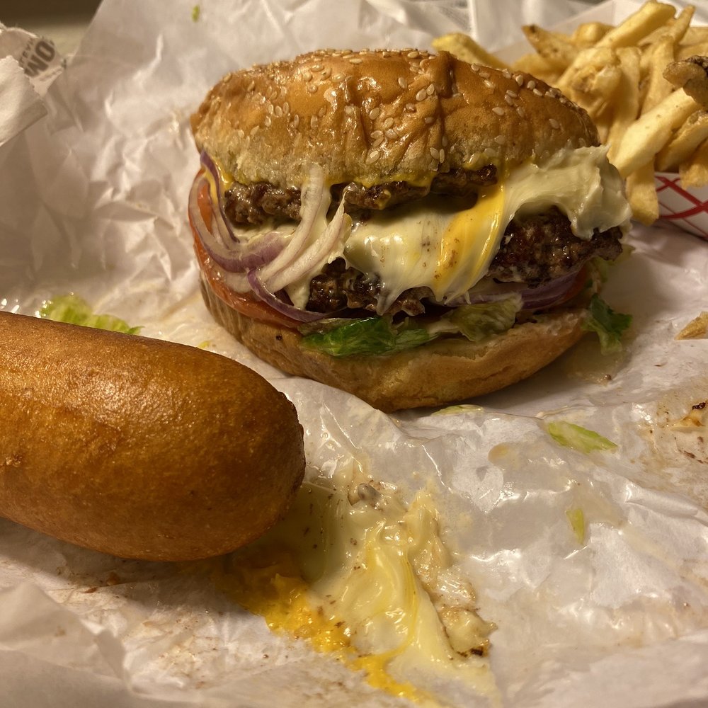 Double cheeseburger extra cheese with fries and a corn dog Double cheeseburger extra cheese with fries and a corn dog