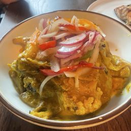 Vegan! Cabbage, cauliflower, potatoes, black rice underneath and onions cooked in a curry sauce. Amazing!