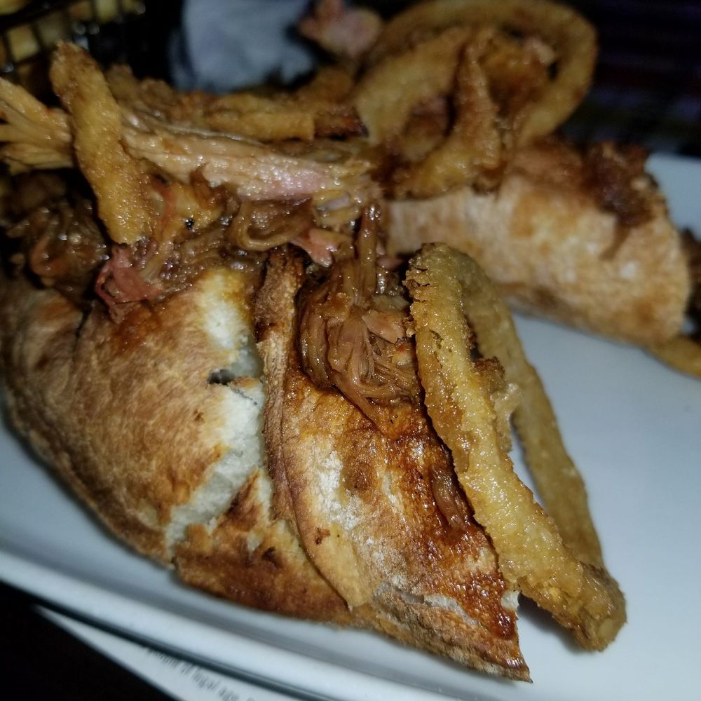 3 Brasseurs - BBQ pulled pork sandwich, with melted swiss cheese and crispy battered onions. - Breweries Near Me - Pointe-Claire, Quebec 3 Brasseurs - BBQ pulled pork sandwich, with melted swiss cheese and crispy battered onions. - Breweries Near Me - Pointe-Claire, Quebec