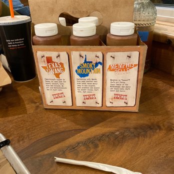 Mission BBQ - four bottles of bbq barbecue sauce on a table - Barbeque Near Me - Jacksonville, North Carolina Mission BBQ - four bottles of bbq barbecue sauce on a table - Barbeque Near Me - Jacksonville, North Carolina