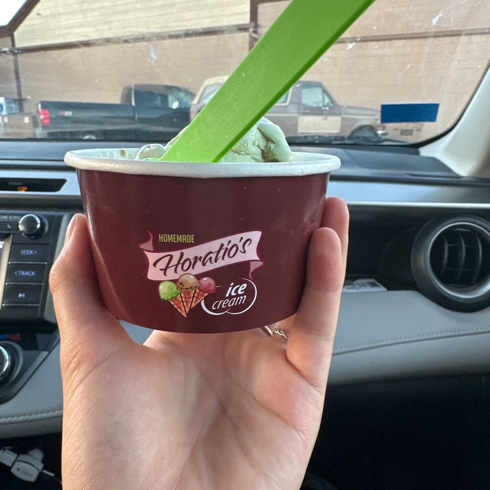 Horatio's Homemade Ice Cream - a hand holding a cup of ice cream - Ice Cream & Frozen Yogurt Near Me - Custer, South Dakota Horatio's Homemade Ice Cream - a hand holding a cup of ice cream - Ice Cream & Frozen Yogurt Near Me - Custer, South Dakota