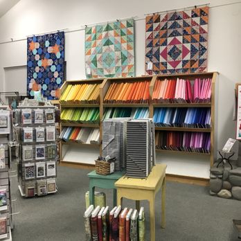Stitchin Post - View of the store with the solids color library and Valori Wells Quilts - Fabric Stores Near Me - Sisters, Oregon Stitchin Post - View of the store with the solids color library and Valori Wells Quilts - Fabric Stores Near Me - Sisters, Oregon
