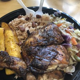 Jerk chicken, rice and peas, cabbage, and plantains. Jerk chicken, rice and peas, cabbage, and plantains.