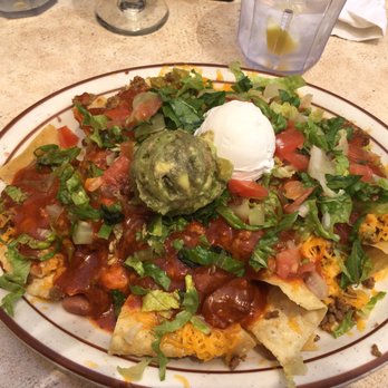 Monroe's Restaurant - The Super Macho Nachos with beef and red chile! - Breakfast & Brunch Near Me - Albuquerque, New Mexico