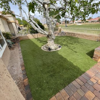 DE landscape - a backyard with artificial grass and brick pavers - Landscaping Near Me DE landscape - a backyard with artificial grass and brick pavers - Landscaping Near Me