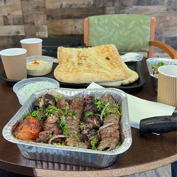 Sunbela - Mixed grill with beef and lamb with their amazing bread which is huge! There is delicious rice underneath. - Bakeries Near Me - Portland, Oregon Sunbela - Mixed grill with beef and lamb with their amazing bread which is huge! There is delicious rice underneath. - Bakeries Near Me - Portland, Oregon