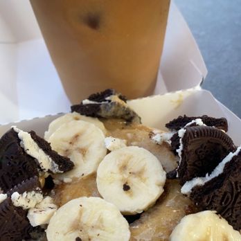 Cinnaholic - Coffee frosting wit Oreos and bananas with an ice coffee - Bakeries Near Me - Long Beach, California Cinnaholic - Coffee frosting wit Oreos and bananas with an ice coffee - Bakeries Near Me - Long Beach, California