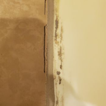Glenn's Tile and Carpet - Jagged/mis-cut tile facing walk-in shower. - Carpeting Near Me - Flint, Michigan