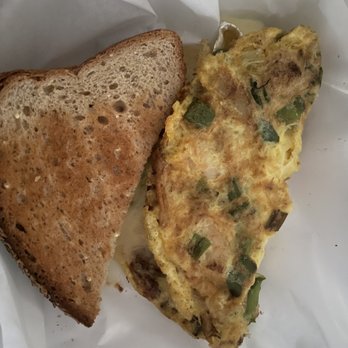 Two Chicks Cafe - Under the sea omelet with wheat toast - Breakfast & Brunch Near Me - New Orleans, Louisiana Two Chicks Cafe - Under the sea omelet with wheat toast - Breakfast & Brunch Near Me - New Orleans, Louisiana