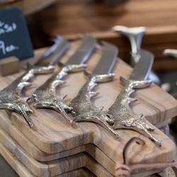 The Cozy Patio - Marlin cheese knife with sandstone cutting board. Charcuterie sets available.