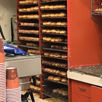 World's Fare Donuts - Racks of happy donuts ready to head out to eager customers! These will be sold,no next day leftovers - Donuts Near Me - Hayward, California World's Fare Donuts - Racks of happy donuts ready to head out to eager customers! These will be sold,no next day leftovers - Donuts Near Me - Hayward, California