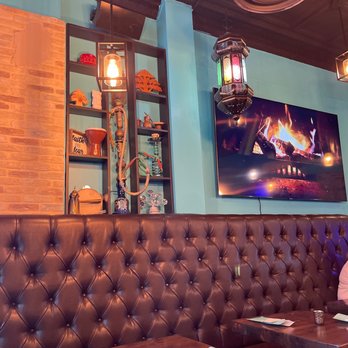 Old City Cafe & Grill - Chill environment with jazz music softly playing in the background and a fireplace crackling on the screen.  Very warm and cozy. - Middle Eastern Near Me - Cranford, New Jersey