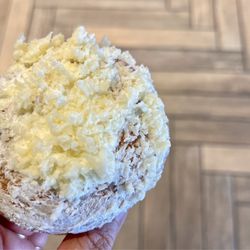 Paderia Bakehouse - Ensaymada (with Aged White Cheddar). Soft brioche bread rolled like a cinnamon roll with butter, sugar, and aged white cheddar on top.