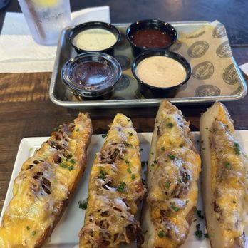 Del's Hideout - Potato wedges with pulled pork, cheese & delicious toppings. - Barbeque Near Me - San Diego, California Del's Hideout - Potato wedges with pulled pork, cheese & delicious toppings. - Barbeque Near Me - San Diego, California