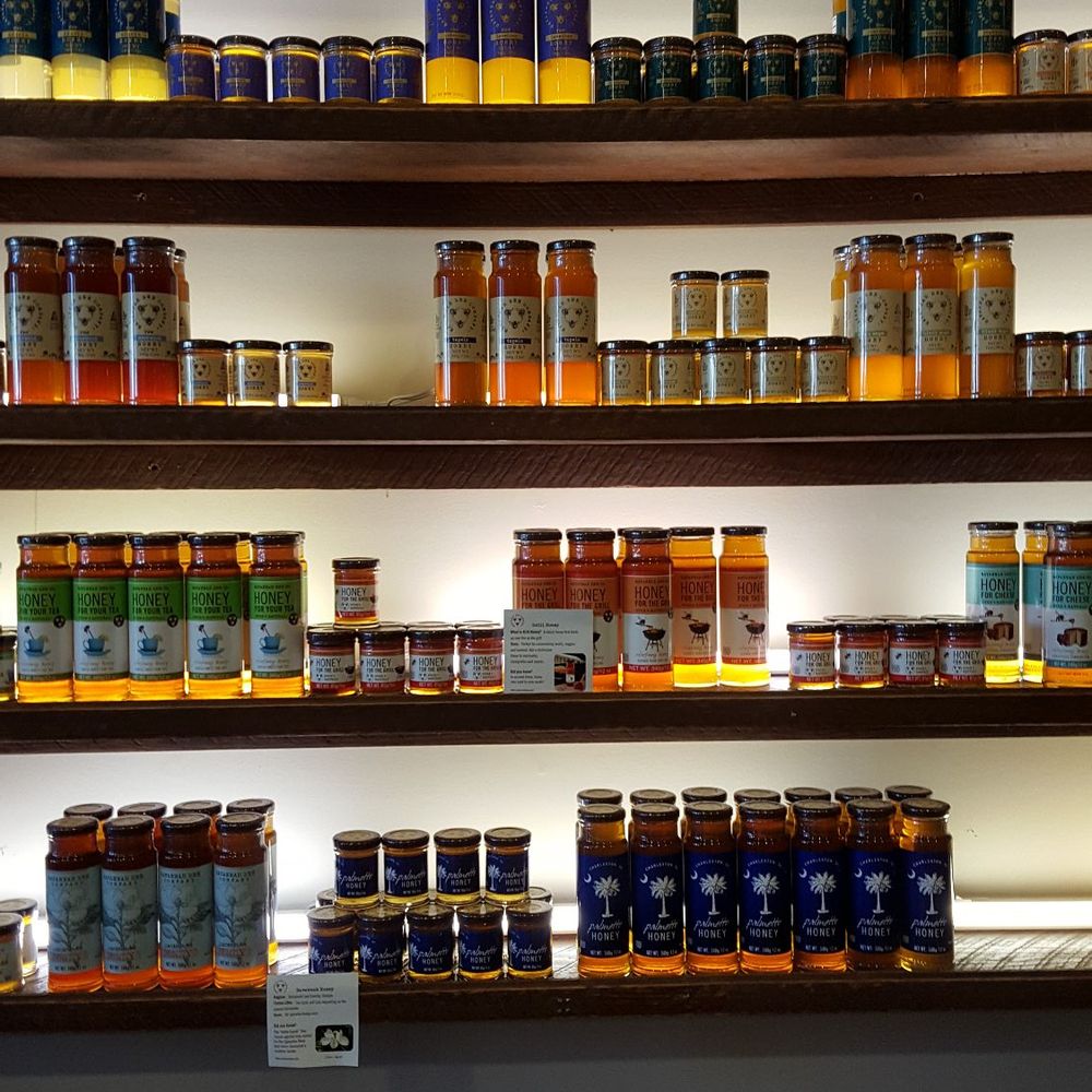 Savannah Bee Company - Wall of honey including rosemary and lavender honey - Cosmetics & Beauty Supply Near Me - Saint Simons Island, Georgia Savannah Bee Company - Wall of honey including rosemary and lavender honey - Cosmetics & Beauty Supply Near Me - Saint Simons Island, Georgia