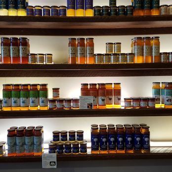 Savannah Bee Company - Wall of honey including rosemary and lavender honey - Cosmetics & Beauty Supply Near Me - Saint Simons Island, Georgia