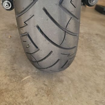 Cycle City Motorsports - Seems more worn on the left side already. The right side still has the sheer of being a new tire. - Motorcycle Repair Near Me - Irvine, California Cycle City Motorsports - Seems more worn on the left side already. The right side still has the sheer of being a new tire. - Motorcycle Repair Near Me - Irvine, California