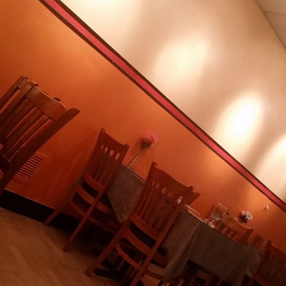 Chontong Thai - a dining room with tables and chairs - Thai Near Me - Delmar, New York