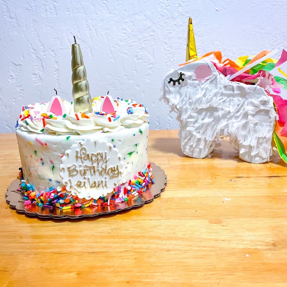 a unicorn and a unicorn cake