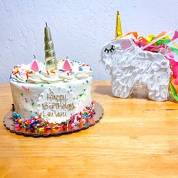 a unicorn and a unicorn cake