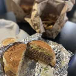 The One and Only Burgers and Fries - double cheeseburger with lettuce and pickle.
