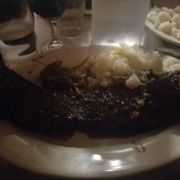 Photo of Sammy's Roumanian Steakhouse - New York, NY, United States. Romanian steak with onions