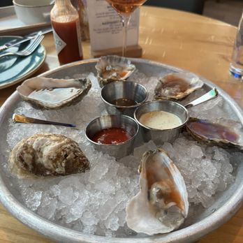 The Point - Nothing like shucking oysters with a glass of Rose champagne to celebrate yourself !! - Salad Near Me - Washington, DC, District of Columbia