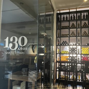 Santo Tomás - Stacked shelves full of wine along the wall. - Wineries Near Me - Baja California, BCN Santo Tomás - Stacked shelves full of wine along the wall. - Wineries Near Me - Baja California, BCN