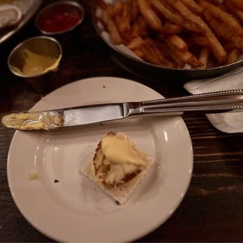 Dylan's Oyster Cellar - 1/4 of the Coddie on a cracker w/ the mustard sauce. - Seafood Near Me - Baltimore, Maryland Dylan's Oyster Cellar - 1/4 of the Coddie on a cracker w/ the mustard sauce. - Seafood Near Me - Baltimore, Maryland