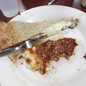 Rosario’s Pizza - We split two slices and they were still huge! Pictured half potions! - Italian Near Me - Concord, North Carolina Rosario’s Pizza - We split two slices and they were still huge! Pictured half potions! - Italian Near Me - Concord, North Carolina